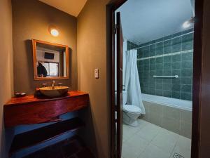 a bathroom with a sink and a toilet and a tub at Finistterra in Tanti