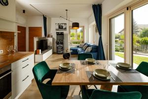 a kitchen and living room with a table and chairs at Rauchhof Apartments in Auer