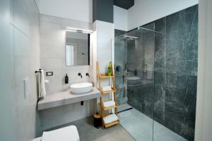 a bathroom with a sink and a shower at SEASIDE TWINS b&b in Fragagnano