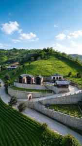 a building on a hill next to a road at Lazivilla Suit Dağ Evi in Rize
