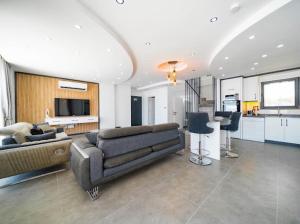 a living room with a couch and a table at Villa Ocak 1 in Kaş