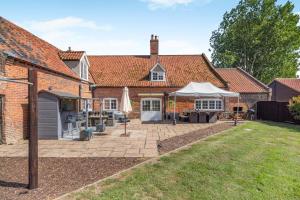 an external view of a house with a patio at 4 Bed in East Harling oc-m31907 in East Harling