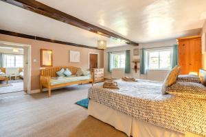 a large bedroom with two beds and a couch at 4 Bed in East Harling oc-m31907 in East Harling