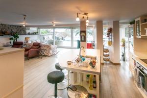 a kitchen and living room with a table and a kitchen and a living room at Villa Büyükada I Private Pier & Seawater Pool in Istanbul