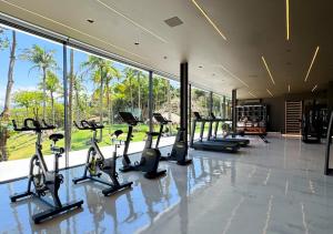 a gym with treadmills and exercise bikes in a room at DPNY Beach Hotel & SPA Ilhabela in Ilhabela