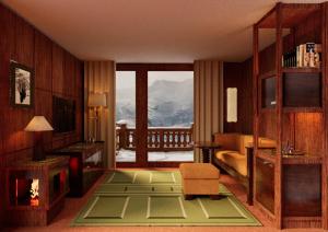 a hotel room with a view of a mountain at Bourbon Hôtel in Courchevel +2 photos