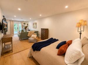 a bedroom with a bed and a living room at Lavender House and Guest House in Ojai