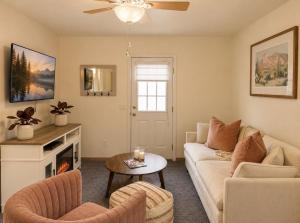 a living room with a couch and a fireplace at Ojai Pixie House in Ojai
