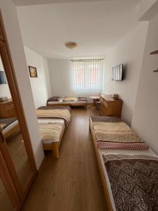 a bedroom with three beds in a room at Villa Aida in Mielno +53 photos