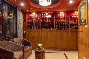 a bar with two chairs and a couch in a room at Hotel Swastik in Kathmandu +9 photos
