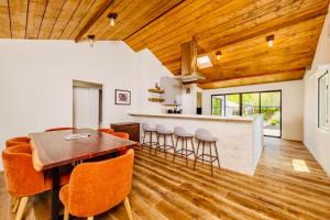 a kitchen and dining room with a wooden ceiling at Downtown Ojai Gem in Ojai