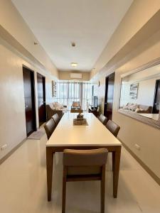 a dining room with a table and chairs at McBride Suites in Punta Engaño