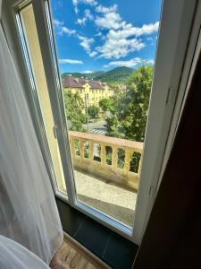 a window with a view of a balcony at Apartament Uricani in Uricani +4 photos