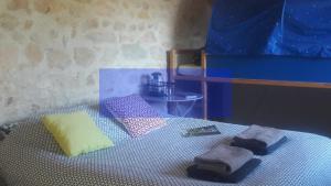 a bedroom with a bed with towels on it at Nuit pour 4 en Auvergne in Vallon-en-Sully +4 photos