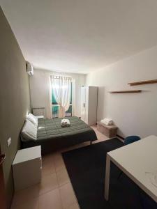 a small bedroom with a bed and a window at Riva Bianca in Ameglia