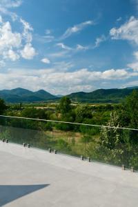 a view of the mountains from a patio at The View in Satu Nou de Sus