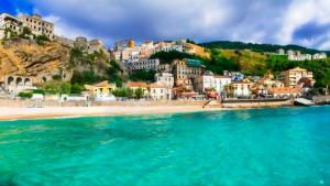 a view of a beach with houses on a mountain at Murat Guesthouse in Pizzo