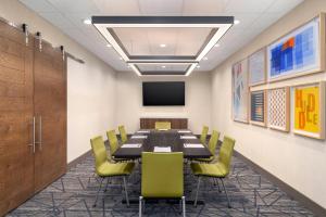 a conference room with a long table and chairs at Holiday Inn Express & Suites Buford NE - Lake Lanier by IHG in Buford