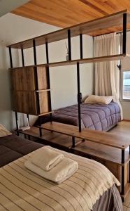 a bedroom with two bunk beds in a room at Dpto General Roca 1355 - La Loggia in San Martín de los Andes
