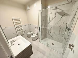 a bathroom with a shower and a sink and a toilet at MS Sea Port Rooms in Ancona +22 photos
