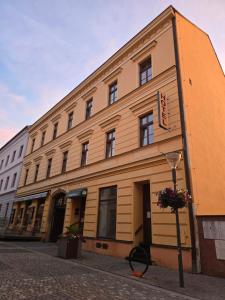 a building on the side of a street at Hotel Corso T-X in Rokycany