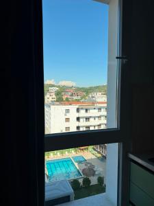 a view from a window of a swimming pool at Kurti Apartment in Golem