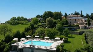 an aerial view of a villa with a swimming pool at Relais Villa Sensano in Pignano