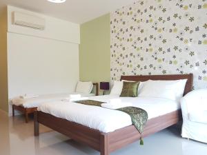 Llit o llits en una habitació de The Hillside Pranburi Resort