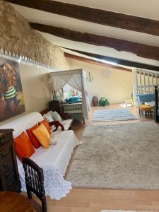 a living room with two beds and a crib at Chateau de Murviel in Murviel +120 photos