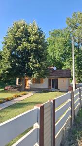 a white fence in front of a house at Vikendica Zajecar in Zvezdan