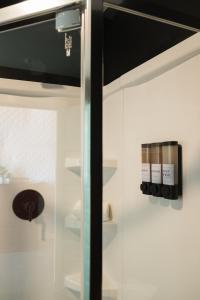 a room with a glass door with bottles of wine at Stargazer Dome Retreat in San Marcos +20 photos