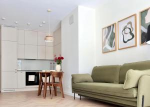 a living room with a couch and a table at GW Apart in Gorzów Wielkopolski