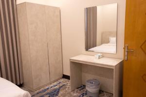 a bathroom with a sink and a mirror at مـهادا Mehada in Taif +56 photos