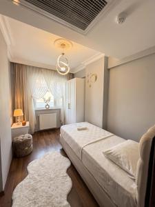 a bedroom with a large bed and a window at Golden Homes in Bostancı +51 photos