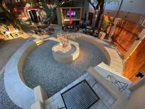 an overhead view of a patio with a fountain and benches at Echo Mountain Inn in Thabazimbi