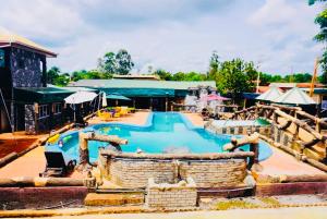 a pool at a resort with a pirate ship at point de distraction in Foumban