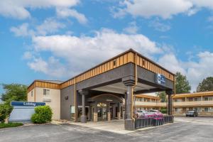 a front view of a building with a parking lot at Best Western Plains Motel in Wall