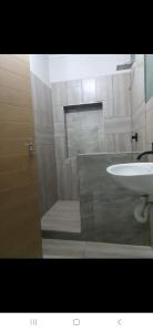 a bathroom with a sink and a shower stall at Cooperville 1 in Potchefstroom