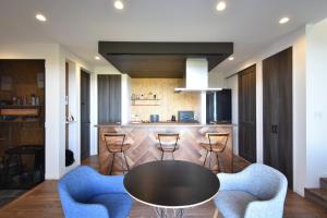 a kitchen with a table and chairs and a counter at The Wave - Vacation STAY 62368v in Hokota