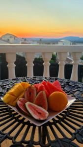 a plate of fruit on top of a table at Enjoy complete seclusion at Casa Delfin, featuring your own stunning private pool and sunset views in Gran Alacant