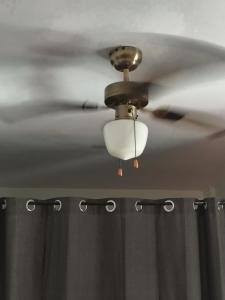 a ceiling fan with a white shower curtain at Hogar, Home, Accueil, Casa, Zuhause in Alicante