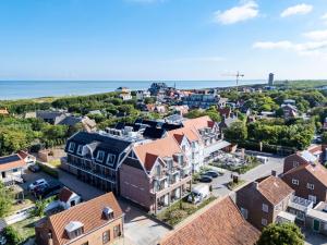 an aerial view of a small town with houses at Hotel The Dunes in Domburg