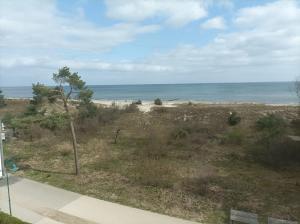 a view of the beach from the balcony of a house at Forum Marinar 37 in Bansin