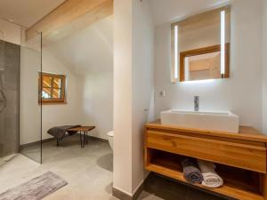 a bathroom with a sink and a mirror at Chalet Jona in Sonnberg +17 photos