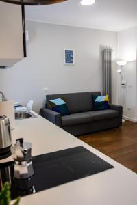 a living room with a couch and a table at Casa Frino in Ghiffa