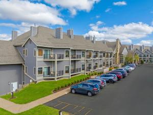 a row of apartment buildings with cars parked in a parking lot at WorldMark Galena in Galena +33 photos