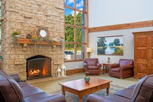 a living room with couches and a fireplace at WorldMark Galena in Galena
