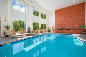 a swimming pool with a brick wall and windows at WorldMark Galena in Galena