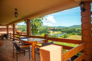 a balcony with a table and chairs and a view at Vila Vera Borsko Jezero in Bor +39 photos