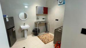 a small bathroom with a sink and a mirror at شاليه الكوثر in Al Baha +6 photos